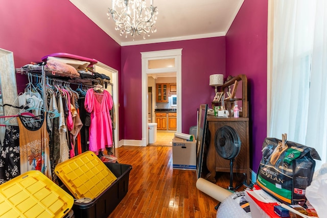 171 White St, Savannah, TN 38372 - spacious closet featuring an inviting chandelier and wood finished floors
