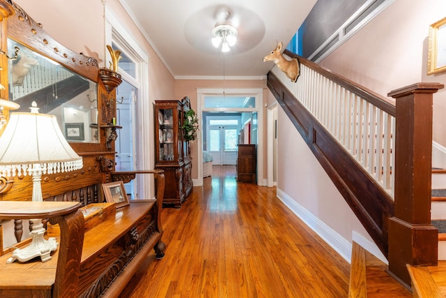 171 White St, Savannah, TN 38372 - hallway with stairs, baseboards, crown molding, and wood finished floors