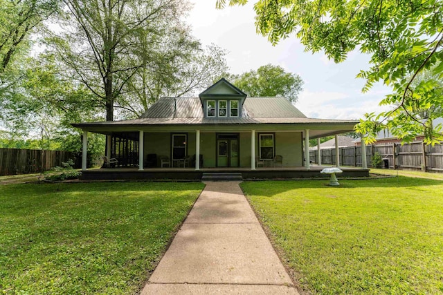 171 White St, Savannah, TN 38372 - farmhouse featuring a porch, fence, a front yard, and metal roof