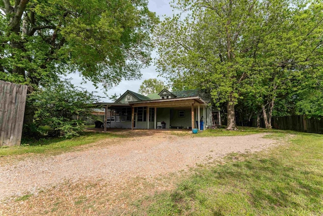 171 White St, Savannah, TN 38372 - back of property with a yard, fence, and dirt driveway