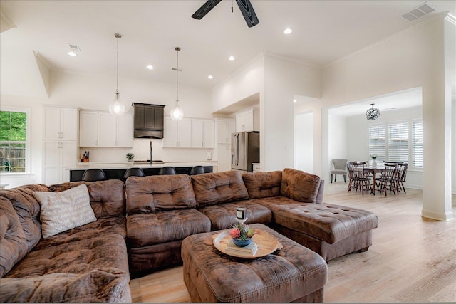 5082 Moudry Run Cv, Lakeland, TN 38002 - living area with crown molding, ceiling fan, light wood-style flooring, recessed lighting, and visible vents