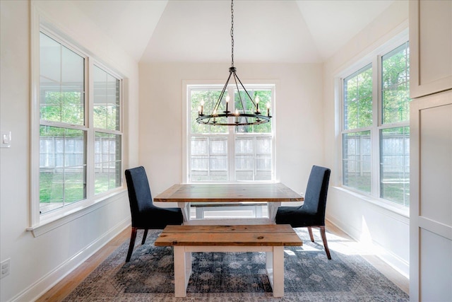 5082 Moudry Run Cv, Lakeland, TN 38002 - dining space featuring a healthy amount of sunlight, vaulted ceiling, wood finished floors, and a chandelier