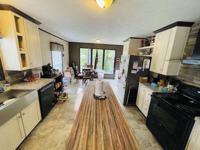325 Geans Ln, Savannah, TN 38372 - kitchen with exhaust hood, a textured ceiling, open shelves, a sink, and black appliances