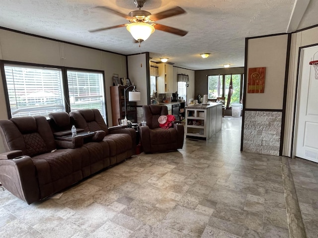 325 Geans Ln, Savannah, TN 38372 - living room featuring a ceiling fan, stone finish flooring, and a textured ceiling