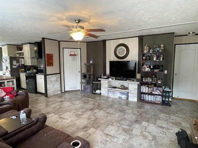 325 Geans Ln, Savannah, TN 38372 - living room featuring a ceiling fan, a textured ceiling, and stone finish floor