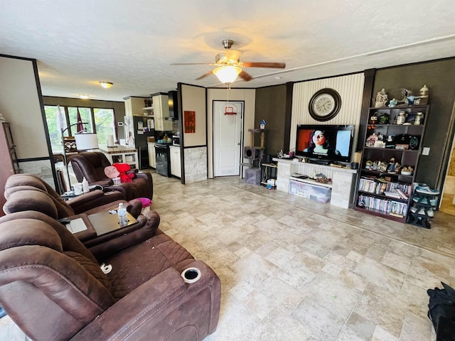 325 Geans Ln, Savannah, TN 38372 - living area featuring ceiling fan and stone finish flooring