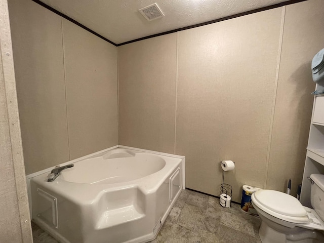 325 Geans Ln, Savannah, TN 38372 - bathroom with toilet, visible vents, a garden tub, and a decorative wall