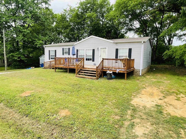 325 Geans Ln, Savannah, TN 38372 - view of front of house featuring a wooden deck and a front lawn