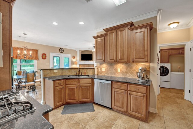 kitchen featuring decorative backsplash, a sink, a peninsula, ornamental molding, and stainless steel appliances