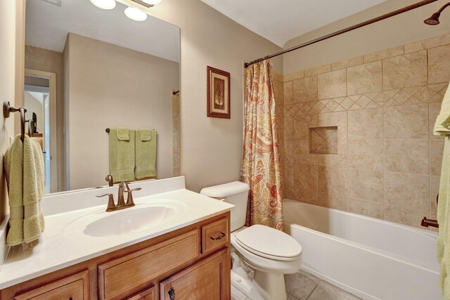 bathroom featuring toilet, shower / bathtub combination with curtain, tile patterned flooring, and vanity