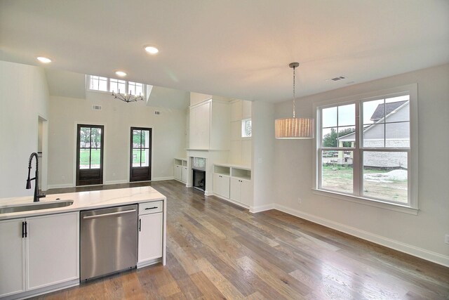 235 Freedom Ln, Rossville, TN 38066 - kitchen featuring pendant lighting, stainless steel dishwasher, wood finished floors, a sink, and recessed lighting