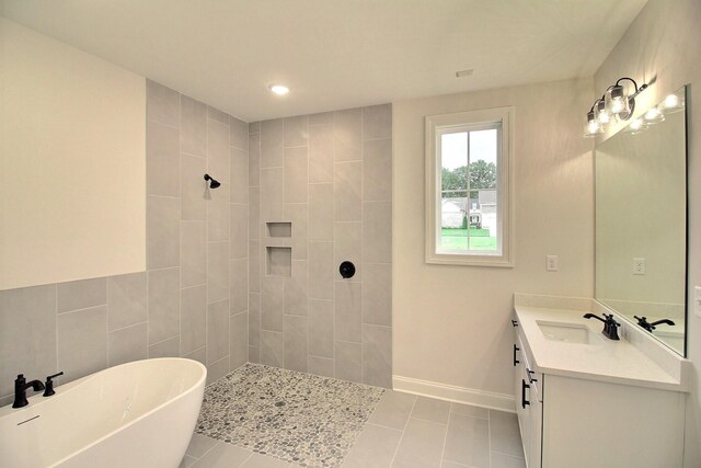 235 Freedom Ln, Rossville, TN 38066 - full bath featuring tile patterned flooring, vanity, a tile shower, and a soaking tub