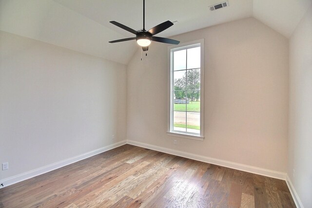 235 Freedom Ln, Rossville, TN 38066 - empty room with ceiling fan, lofted ceiling, wood finished floors, and visible vents