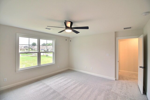 235 Freedom Ln, Rossville, TN 38066 - spare room featuring visible vents, baseboards, ceiling fan, and light colored carpet