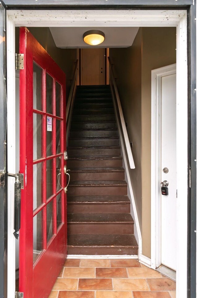 stairs featuring baseboards