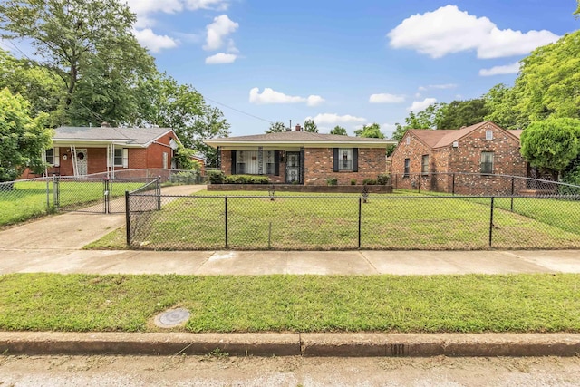 2377 Warren St, Memphis, TN 38106 - view of front facade featuring a gate, brick siding, and a porch