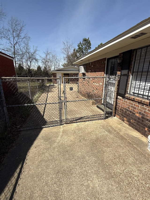 view of gate with fence