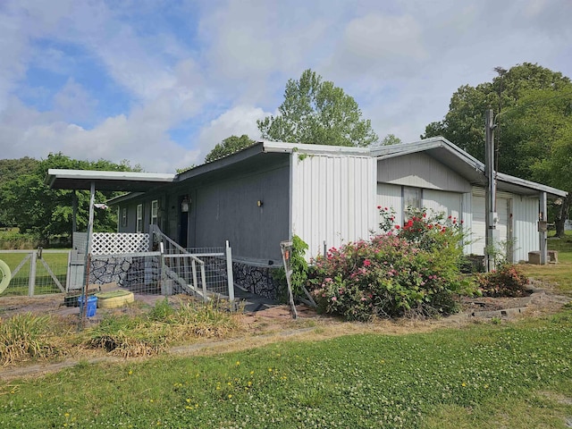 3845 Forked Deer Rd, Gates, TN 38037 - view of property exterior with a lawn and fence
