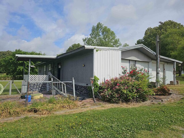 3845 Forked Deer Rd, Gates, TN 38037 - view of property exterior with a lawn and fence