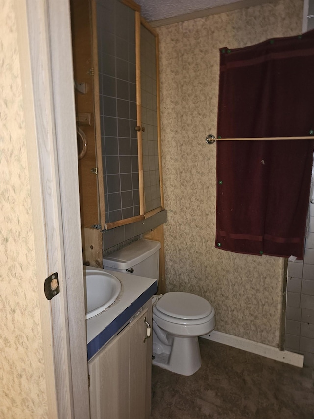 3845 Forked Deer Rd, Gates, TN 38037 - bathroom featuring toilet, wallpapered walls, and vanity
