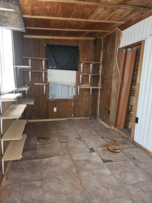 3845 Forked Deer Rd, Gates, TN 38037 - unfurnished living room featuring wooden walls, wooden ceiling, and plenty of natural light