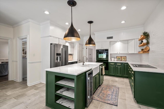 kitchen with a sink, open shelves, green cabinetry, and black appliances