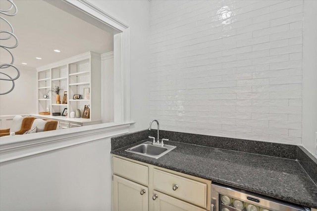bar with a sink and wine cooler