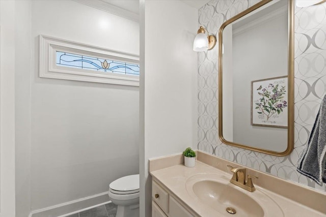 half bath featuring vanity, tile patterned flooring, and toilet