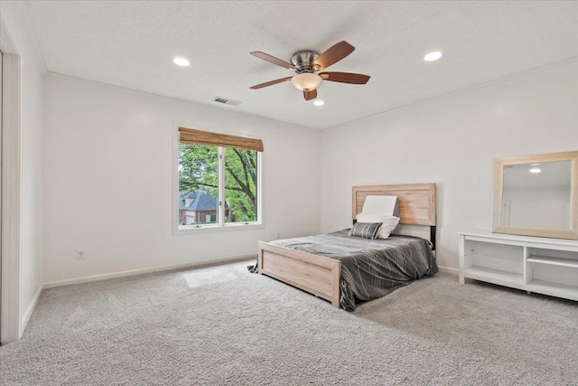carpeted bedroom with recessed lighting, a ceiling fan, baseboards, and visible vents