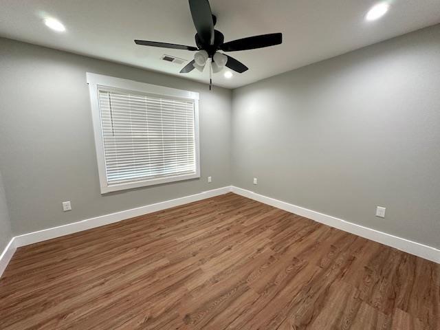 50 Melrose Cv, Savannah, TN 38372 - empty room featuring a ceiling fan, recessed lighting, baseboards, visible vents, and wood finished floors