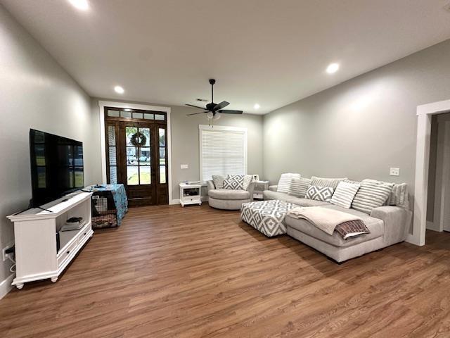 50 Melrose Cv, Savannah, TN 38372 - living room featuring recessed lighting, baseboards, and wood finished floors