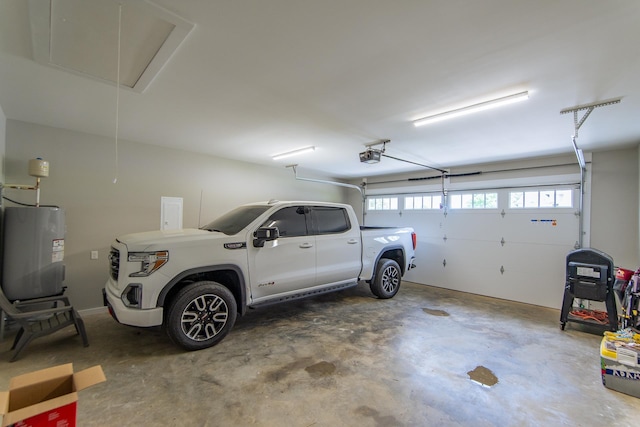 50 Melrose Cv, Savannah, TN 38372 - garage featuring water heater and a garage door opener