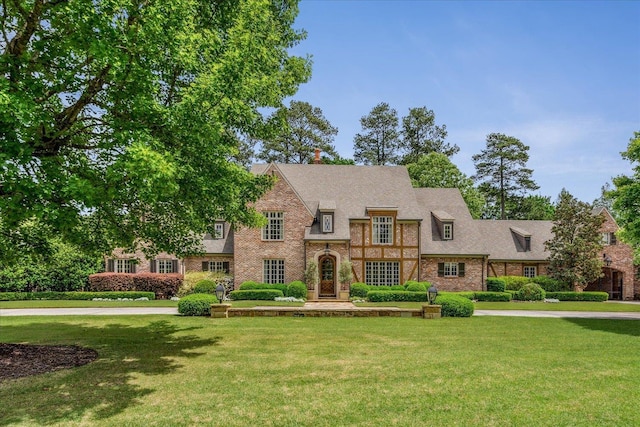 294 Dubray Manor Dr, Collierville, TN 38017 - tudor home with brick siding and a front yard