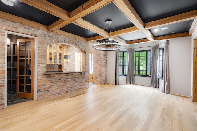 294 Dubray Manor Dr, Collierville, TN 38017 - unfurnished living room with baseboards, brick wall, wood finished floors, and coffered ceiling