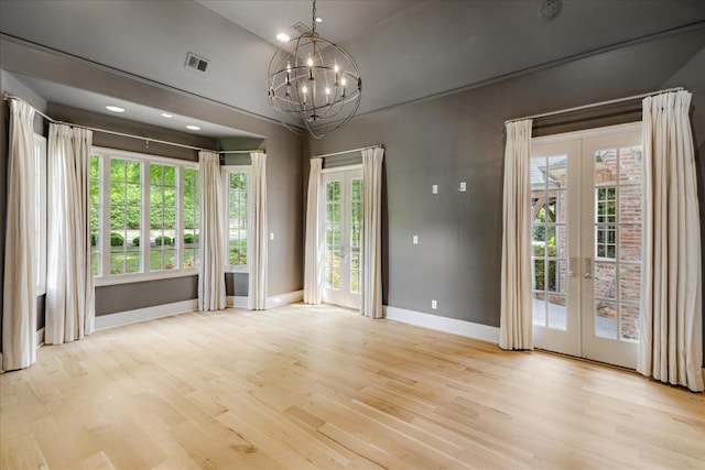 294 Dubray Manor Dr, Collierville, TN 38017 - spare room featuring baseboards, plenty of natural light, wood finished floors, and french doors