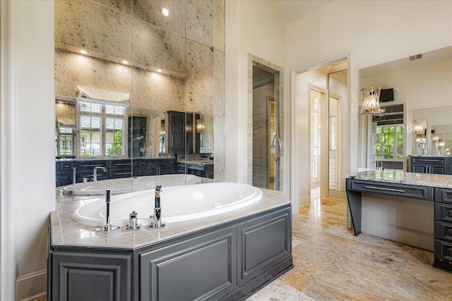 294 Dubray Manor Dr, Collierville, TN 38017 - bathroom featuring visible vents, a bath, a chandelier, and vanity