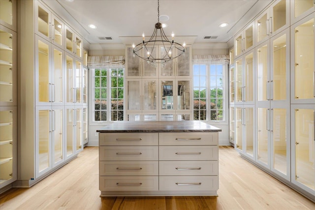 294 Dubray Manor Dr, Collierville, TN 38017 - spacious closet with visible vents, light wood-style floors, and a notable chandelier