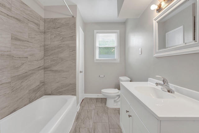 bathroom with vanity, marble finish floor, toilet, baseboards, and bathtub / shower combination