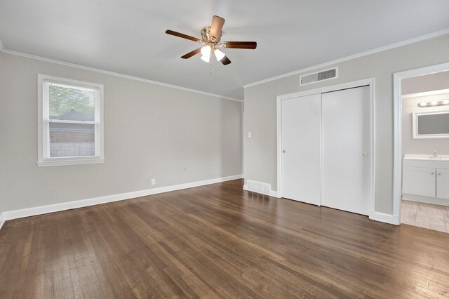 4277 Rhodes Ave, Memphis, TN 38111 - unfurnished bedroom featuring crown molding, visible vents, wood finished floors, and a closet