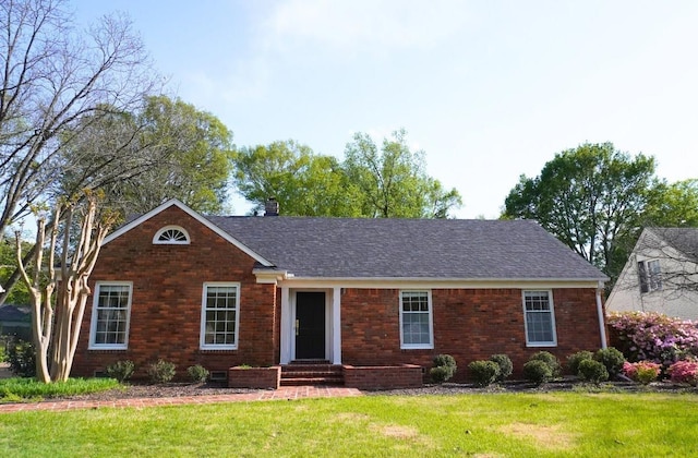 5483 Brantford Rd, Memphis, TN 38120 - view of front of house featuring brick siding, a chimney, roof with shingles, and a front lawn