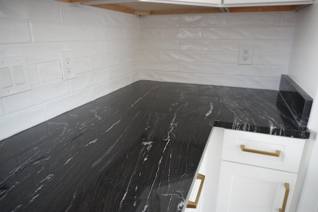 5483 Brantford Rd, Memphis, TN 38120 - kitchen with decorative backsplash, white cabinetry, and dark countertops