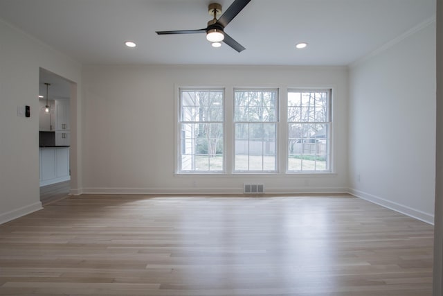 5483 Brantford Rd, Memphis, TN 38120 - unfurnished room featuring visible vents, ornamental molding, light wood-style floors, and baseboards