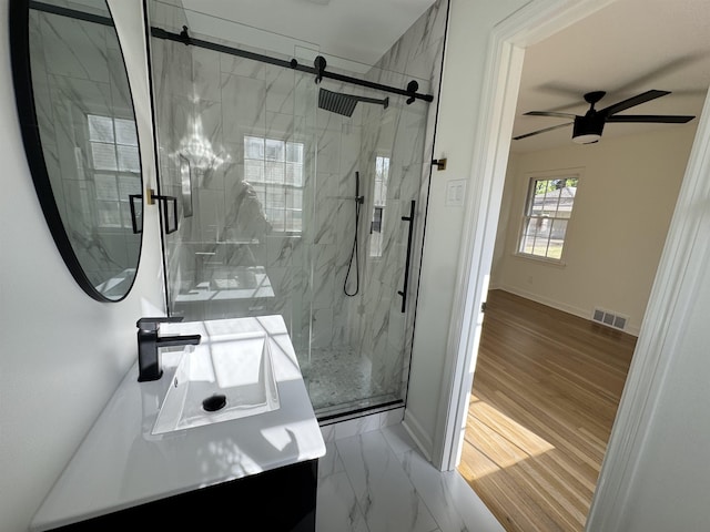 5483 Brantford Rd, Memphis, TN 38120 - full bath with visible vents, vanity, baseboards, a ceiling fan, and a marble finish shower