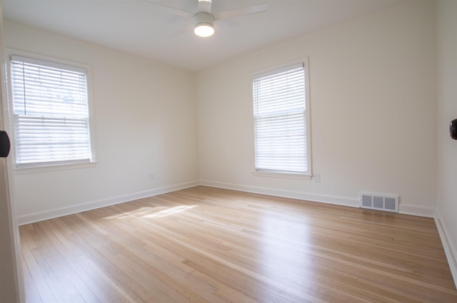 5483 Brantford Rd, Memphis, TN 38120 - unfurnished room with plenty of natural light, light wood finished floors, ceiling fan, and visible vents