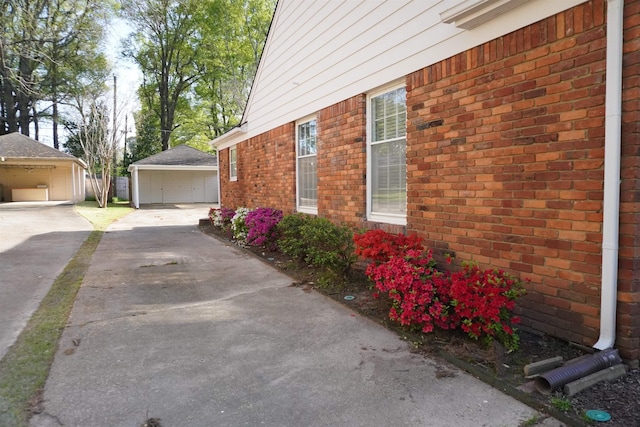 5483 Brantford Rd, Memphis, TN 38120 - view of side of home with brick siding and an outbuilding