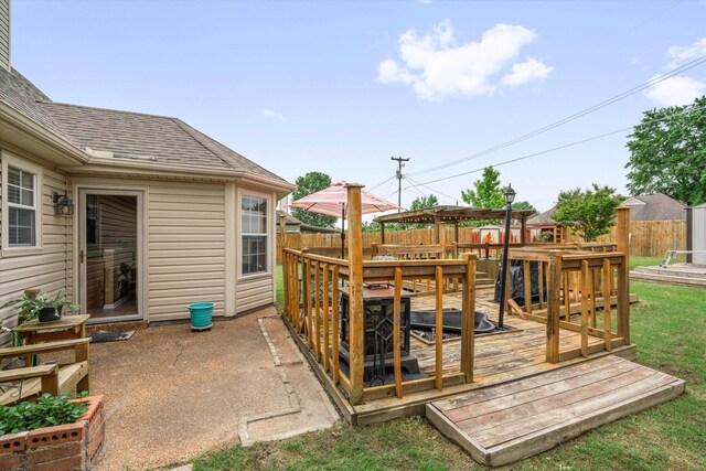 exterior space with a deck and a fenced backyard