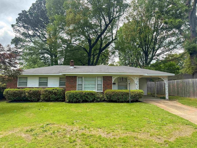 1439 Woodston Rd, Memphis, TN 38117 - ranch-style home with a chimney, a carport, fence, a front lawn, and concrete driveway