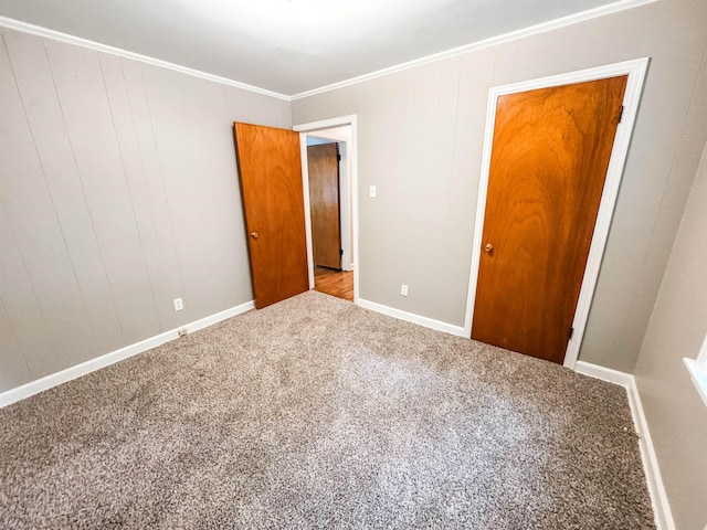 1439 Woodston Rd, Memphis, TN 38117 - unfurnished bedroom featuring carpet floors, baseboards, and ornamental molding