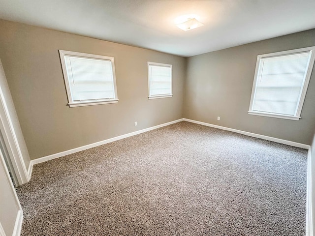 1439 Woodston Rd, Memphis, TN 38117 - empty room featuring carpet floors and baseboards
