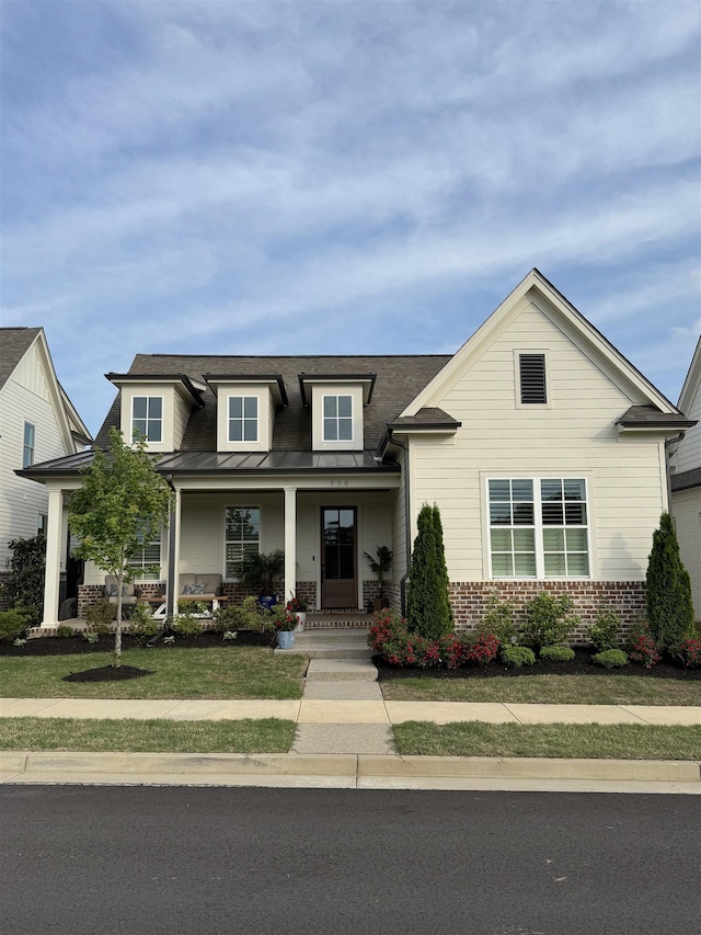330 Mary Taylor Way, Piperton, TN 38017 - craftsman house featuring brick siding, a front yard, a porch, a standing seam roof, and roof with shingles